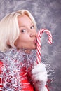 Portrait of young woman kissing lollipop Royalty Free Stock Photo