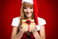 Portrait of young, woman Santa with gift boxes Royalty Free Stock Photo