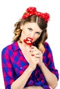 Portrait of young woman with vintage make-up and hairstyle with lollipop Royalty Free Stock Photo