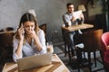 Portrait young shocked business woman sitting in front of laptop computer Royalty Free Stock Photo