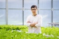 Portrait of young smart farmer using digital tablet computer for inspecting. using technology in agriculture field application in Royalty Free Stock Photo