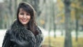 Portrait of a young smile woman wearing fur