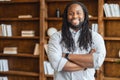 Portrait of a young broad-shouldered african unshaven man with dreadlocks Royalty Free Stock Photo