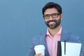 Portrait of Young Smiley Businessman Holding Coffee Cup and Folder with Documents Royalty Free Stock Photo