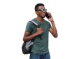 Portrait of young smiling african man student calling on smartphone wearing backpack, sunglasses isolated on white background Royalty Free Stock Photo