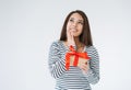 Portrait of young smiling asian woman with gift box in hands on white background isolated Royalty Free Stock Photo