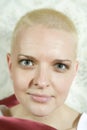 Portrait of young smiling bald blond woman