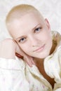 Portrait of young smiling bald blond woman