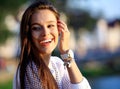 Portrait Of Young Smiling Beautiful Woman. Close-up portrait of a fresh and beautiful young fashion model posing outdoor Royalty Free Stock Photo