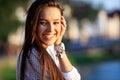 Portrait Of Young Smiling Beautiful Woman. Close-up portrait of a fresh and beautiful young fashion model posing outdoor Royalty Free Stock Photo