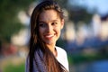 Portrait Of Young Smiling Beautiful Woman. Close-up portrait of a fresh and beautiful young fashion model posing outdoor Royalty Free Stock Photo