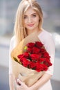 Portrait Of Young Smiling Beautiful Woman with flowers