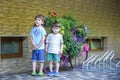 Portrait of young smiling boys in striped shirt in park at evening. interact with each other. brothers are and discussing somet