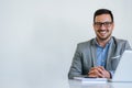 Portrait of young smiling cheerful businessman in office looking at camera copy space Royalty Free Stock Photo