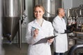 Female worker on beer brewery. Royalty Free Stock Photo