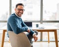 Portrait of young smiling happy handsome successful businessman entrepreneur freelancer working looking back Royalty Free Stock Photo
