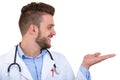 Portrait of a Young smiling male doctor pointing finger away isolated on a white background Royalty Free Stock Photo