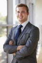 Portrait of a young smiling professional man, arms crossed Royalty Free Stock Photo