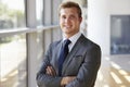 Portrait of a young smiling professional man, arms crossed Royalty Free Stock Photo