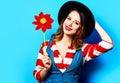 Smiling woman with red pinwheel Royalty Free Stock Photo