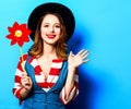 Smiling woman with red pinwheel Royalty Free Stock Photo