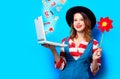 Woman with laptop and pinwheel and with gifts Royalty Free Stock Photo