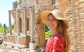 Portrait of young smiling woman with hat in famous Taormina Greek Theatre, Sicily, Italy Royalty Free Stock Photo