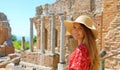 Portrait of young smiling woman with hat in famous Taormina Greek Theatre, Sicily, Italy Royalty Free Stock Photo