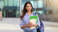 Portrait of young smiling woman holding books, study, education, knowledge, goal concept Royalty Free Stock Photo