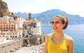 Portrait of young smiling woman with sunglasses in Atrani village, Amalfi Coast, Italy. Picture of female tourist in her summer Royalty Free Stock Photo