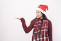 Portrait of young smiling woman wearing red Santa Claus hat isolated white background studio Royalty Free Stock Photo