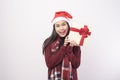 Portrait of young smiling woman wearing red Santa Claus hat isolated white background studio Royalty Free Stock Photo