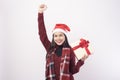 Portrait of young smiling woman wearing red Santa Claus hat isolated white background studio Royalty Free Stock Photo