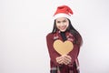 Portrait of young smiling woman wearing red Santa Claus hat isolated white background studio Royalty Free Stock Photo