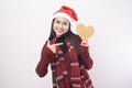 Portrait of young smiling woman wearing red Santa Claus hat isolated white background studio Royalty Free Stock Photo