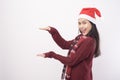 Portrait of young smiling woman wearing red Santa Claus hat isolated white background studio Royalty Free Stock Photo