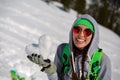 Portrait of young snowboarder girl With snow heart in hands Royalty Free Stock Photo