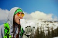 Portrait of young snowboarder girl With snow heart in hands Royalty Free Stock Photo