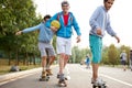 Portrait of young sportive team of teenagers with skateboards