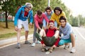 Portrait of young sportive team of teenagers with skateboards