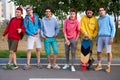 Portrait of young sportive team of teenagers with skateboards