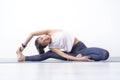 Portrait of young sporty Asian woman warm up exercise work out sitting on Yoga mat at home, A woman with smiley face stretching,