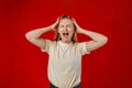 Portrait of young stressed angry woman holding hands on head. Negative human emotions, headache face expressions Royalty Free Stock Photo