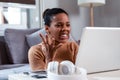 Portrait young stressed displeased worried business woman sitting in front of laptop Royalty Free Stock Photo