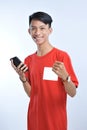 Portrait of a young student asian man talking on mobile phone, speak happy smile Royalty Free Stock Photo