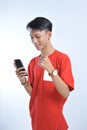 Portrait of a young student asian man talking on mobile phone, speak happy smile Royalty Free Stock Photo