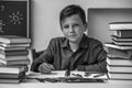 Portrait of young student doing homework. Black and white photo. Royalty Free Stock Photo