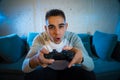 Close up portrait of young addicted man playing video game at night in gaming and addiction concept Royalty Free Stock Photo