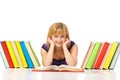 Portrait of a young student reading a book lying on a floor Royalty Free Stock Photo