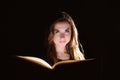 portrait of young student reading a book over black background Royalty Free Stock Photo